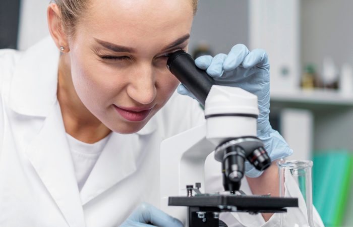 front-view-female-researcher-laboratory-with-microscope front-view-female-researcher-laboratory-with-microscope